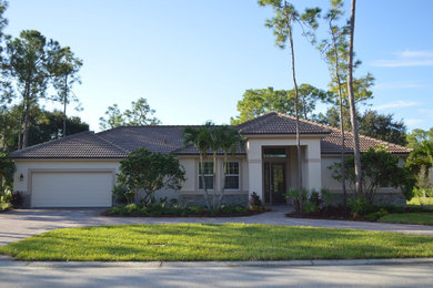 Tuscan home design photo in Miami