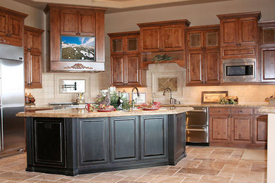Example of a mid-sized transitional u-shaped ceramic tile and beige floor eat-in kitchen design in New York with a double-bowl sink, raised-panel cabinets, dark wood cabinets, soapstone countertops, beige backsplash, stone slab backsplash, stainless steel appliances and an island