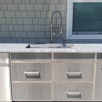 Resort like home boasts a resort like outdoor kitchen in BridgeHampton, NY