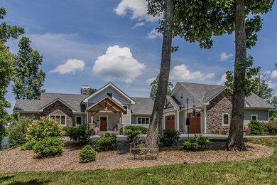 Inspiration for a large rustic gray two-story mixed siding gable roof remodel in Other