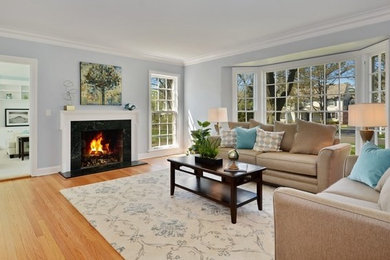 Example of a transitional formal light wood floor living room design in Chicago with blue walls
