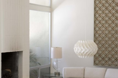 Photo of a contemporary living room in Los Angeles with white walls.