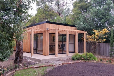 Example of a small trendy home design design in Melbourne
