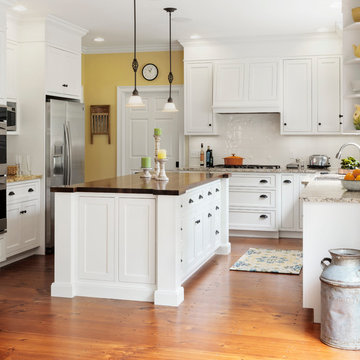 Farmhouse kitchen with butcher block island