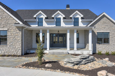 Elegant white one-story mixed siding house exterior photo in Omaha with a mixed material roof and a black roof