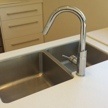 Corian Benchtops with Dezignatek White Gloss cabinetry
