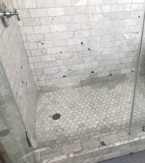 Carrera marble shower is turning grey.
