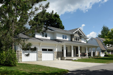 Large traditional two-storey white exterior in Ottawa with wood siding and a gable roof.