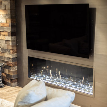 Metal Surround Fireplace on Reclaimed Wood Wall