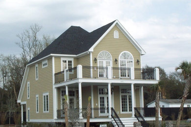 Inspiration for a timeless two-story house exterior remodel in Other with a shingle roof