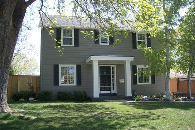 Inspiration for a large timeless gray two-story wood gable roof remodel in Salt Lake City