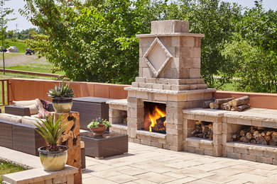 Design ideas for a large contemporary backyard patio in New York with a water feature, concrete pavers and no cover.