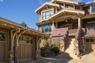 Example of a large arts and crafts brown three-story mixed siding exterior home design in San Francisco