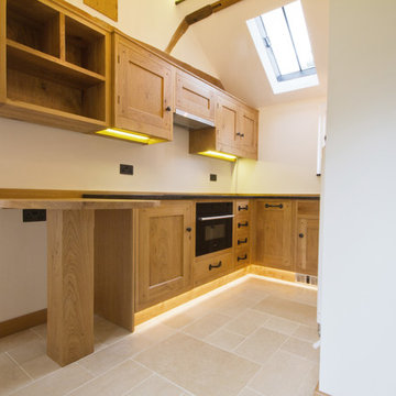 A Guesthouse With A Small Yet Beautiful Oak Kitchen And Cloakroom