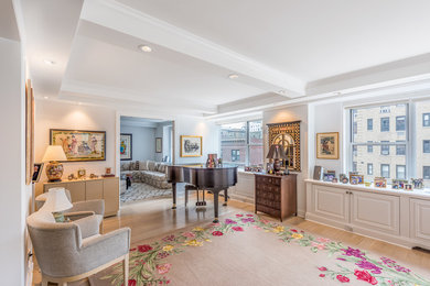 Living room - large traditional enclosed light wood floor and beige floor living room idea in New York with a music area, white walls, no fireplace and no tv