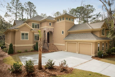 Island style brown two-story exterior home photo in Atlanta