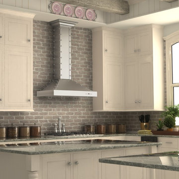 White kitchen featuring a ZLINE KB2-4SSXS Stainless Steel Range Hood