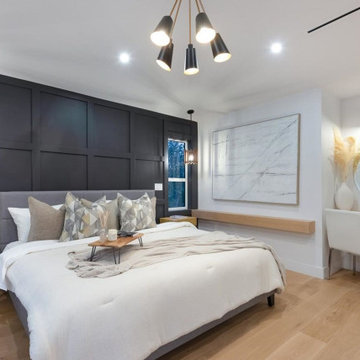 Master Bedroom against a black paneled wall.