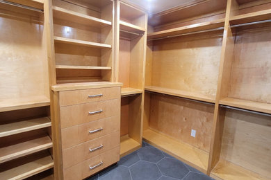 Mid-sized mid-century modern ceramic tile and gray floor built-in closet photo in Houston with flat-panel cabinets and light wood cabinets