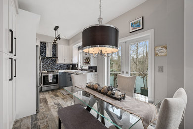 Example of a minimalist dining room design in Toronto