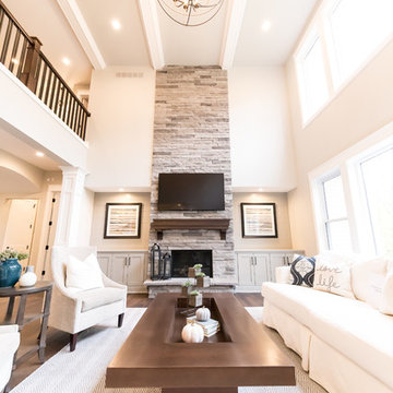 Living Room Remodel Featuring a Ledgestone Fireplace + Cabinetry + Shaw Coretec