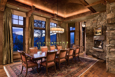 Great room - large traditional medium tone wood floor and brown floor great room idea in Other with gray walls, a standard fireplace and a stone fireplace