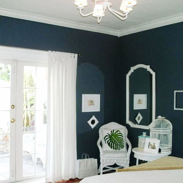 charcoal bedroom with bright white trim and curtains, before french door casing