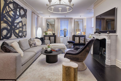 Example of a large trendy open concept dark wood floor and black floor living room design in New York with gray walls, a standard fireplace, a tile fireplace and a wall-mounted tv