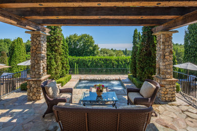 Example of a tuscan patio design in New York