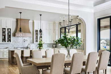 Example of a mid-sized classic light wood floor and coffered ceiling kitchen/dining room combo design in Dallas