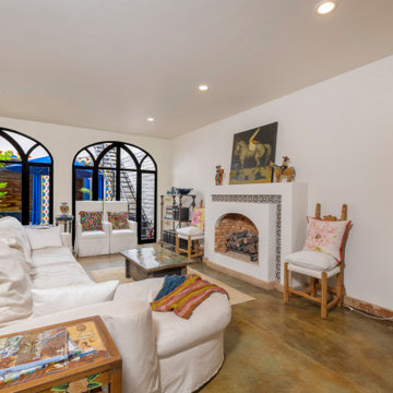 Villa Andalucia - Den with Fireplace leading to Courtyard