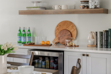 Example of a transitional home bar design in New York