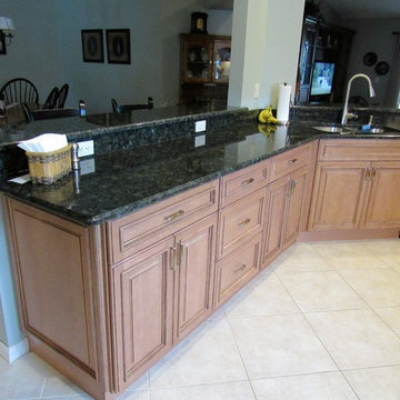 Galaxy Pecan cabinets with peacock green granite