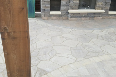 Mid-sized traditional backyard patio in Dallas with a fire feature, natural stone pavers and a gazebo/cabana.