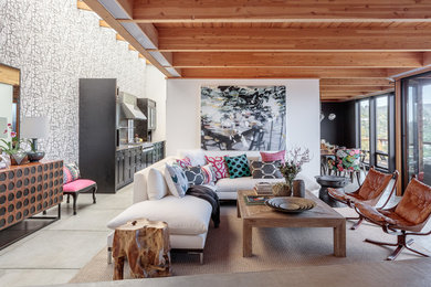 Large eclectic open concept concrete floor family room photo in San Francisco with white walls, no fireplace and no tv
