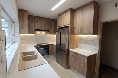 Example of a minimalist kitchen design in Other