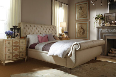 Large elegant master medium tone wood floor bedroom photo in Toronto with blue walls and a standard fireplace