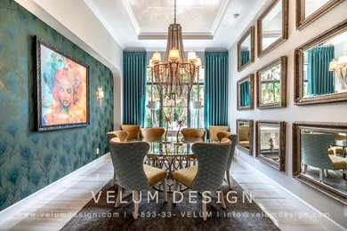 This is an example of a contemporary dining room in Miami with green walls, marble floors, no fireplace and beige floor.