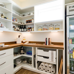 Transitional kitchen pantry remodeling - Example of a transitional l-shaped dark wood floor and brown floor kitchen pantry design in Other with open cabinets and white cabinets