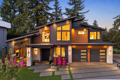Example of a huge trendy gray three-story mixed siding house exterior design in Portland