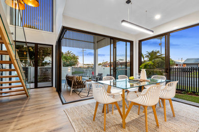This is an example of a contemporary kitchen/dining combo in Sunshine Coast.