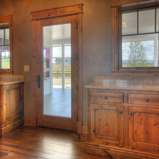 Inspiration for a medium sized rural single-wall separated utility room in Other with shaker cabinets, medium wood cabinets, laminate countertops, beige walls, medium hardwood flooring and brown floors.