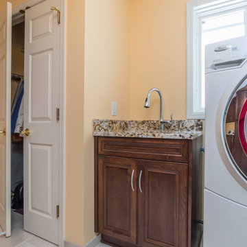Transitional Style Laundry/Mudroom With Medium Stained Maple Cabinets
