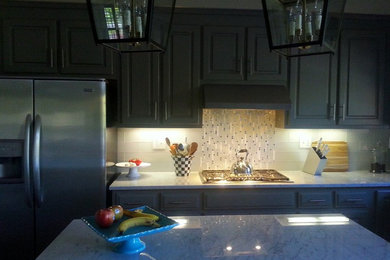 Kitchen - kitchen idea in Raleigh with marble countertops, multicolored backsplash, matchstick tile backsplash and stainless steel appliances