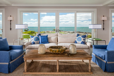 Inspiration for a mid-sized transitional formal and open concept medium tone wood floor and brown floor living room remodel in New York with gray walls
