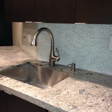 Single sink with pull-down faucet and soap dispenser