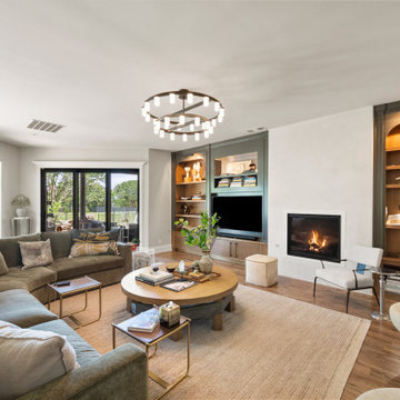 Custom Arched Media Wall with Plaster Fireplace and Oak Shelving