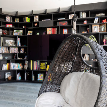 Une bibliothèque singulière dans une pièce de vie agrandie