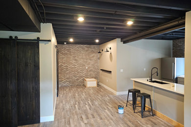 Inspiration for a large basement remodel in Kansas City with white walls