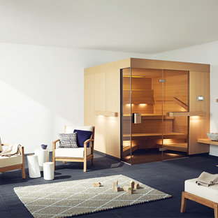 Foto di una grande sauna minimalista con pareti bianche, pavimento con piastrelle in ceramica e pavimento nero